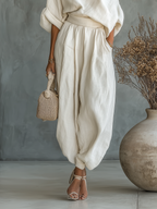 Natalia – Tuta Elegante con Scollatura Asimmetrica